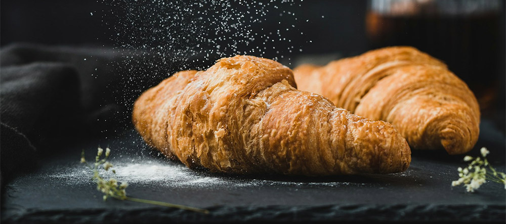 Artisanal bakery display — cakes, pastries and breads in Delhi bakery