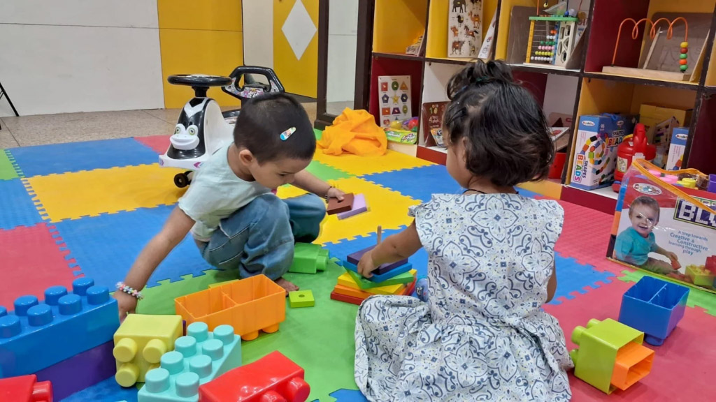Delhi preschool classroom — safe, colourful play school setup with teachers