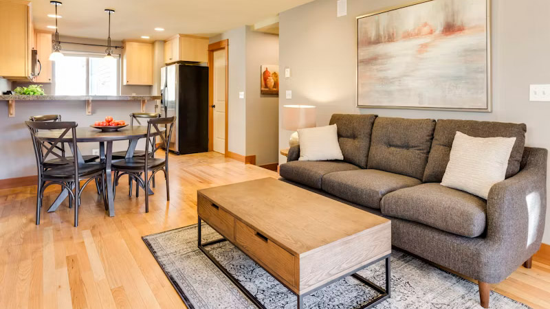 Delhi home interior — false ceiling, warm lighting and sofa styling